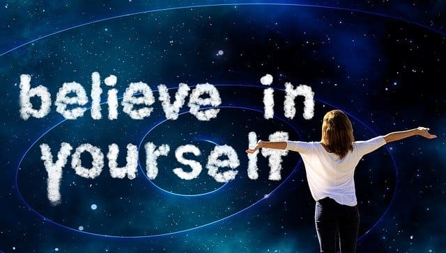 Believe in yourself A woman with outstretched arms beneath the words "believe in yourself"