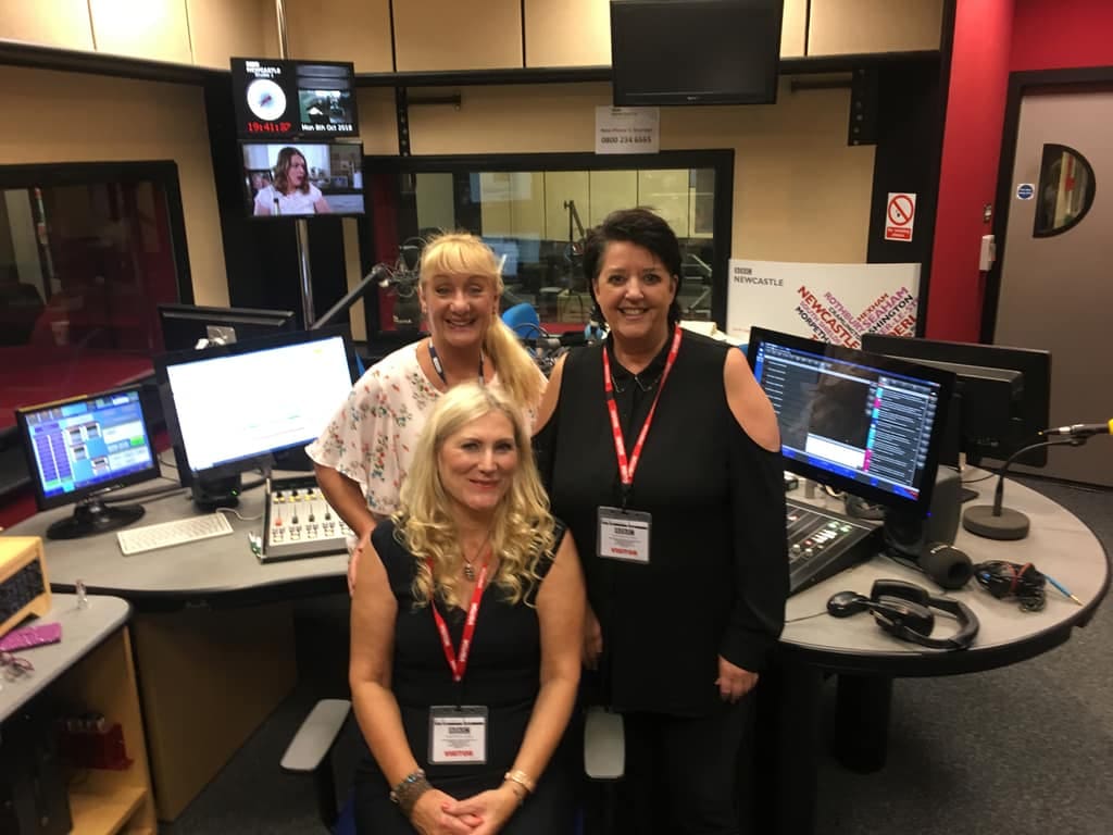Sonya Hudson on the radio Sonya Hudson with two presenters in a radio studio